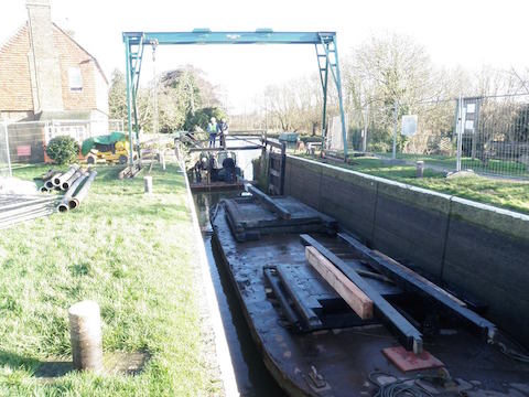 With limited vehicle access to many of our locks, we have to float the new lock gates to site and lower them into position with a good old fashioned block and tackle.