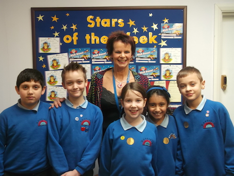 Guildford MP Anne Milton with pupils at Weyfiueld Primary Academy.
