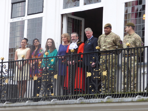 Some of those who took part in the ceremony and special guests on the balcony of the Guildford for the flag raising.
