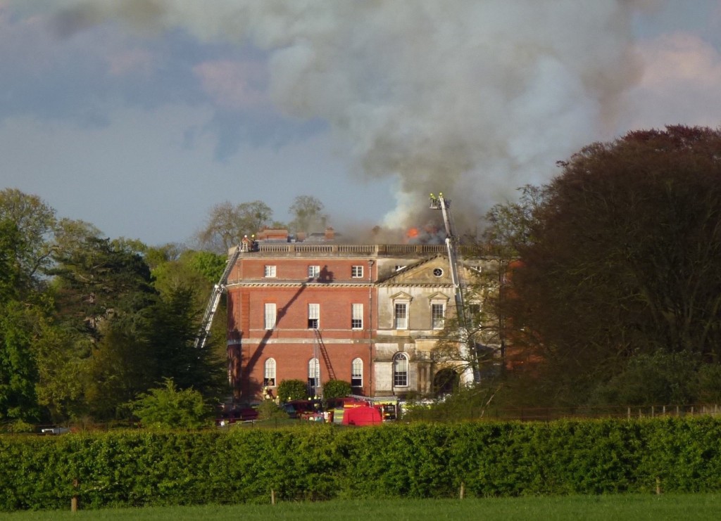 Clandon House still ablaze around 7pm this evening two hours after the fire is believed to have started.