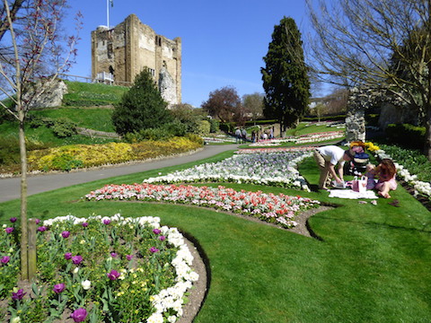 Blue skies, spring flowers and lots of people enjoying Guildford's Castle Grounds.
