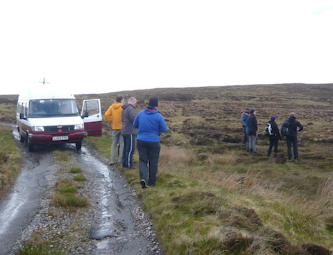 The minibus on the road that was mainly potholes.