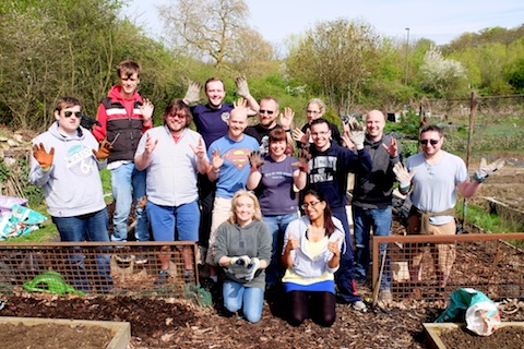 The team from EA Games lend a helping hand with people from the halow project on their allotment.