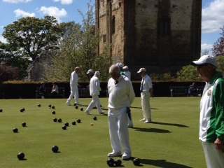 Castle Green Bowling Club members (green strip) playing against Hayling Island (in whites) on the green by Guildford Castle, Saturday , May 9.