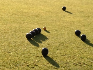 Evening shadows on the bowling green.