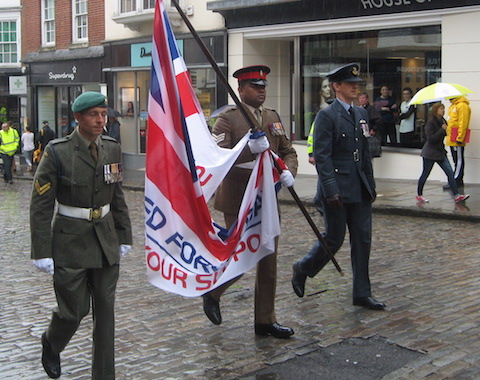 Lance Sargeant Johnson Beharry VC carries the flag up Guildford High Street.