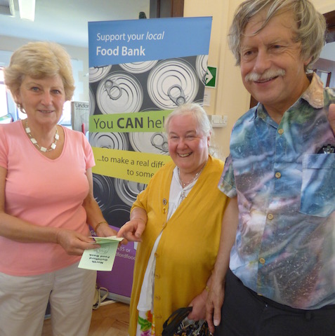 Ann Mather of the North Guildford Foodbank with Cllr Liz Hopper and her husband, Philip.