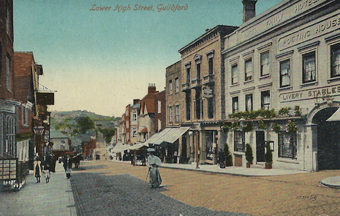 Guildford High Street featuring the Angel Hotel in  the early 1900s.