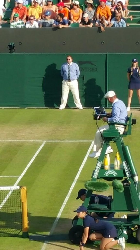 Ferenc, in the background, is a qualified chair umpire but not at the grade that would allow him to officiate in that role at Wimbledon.