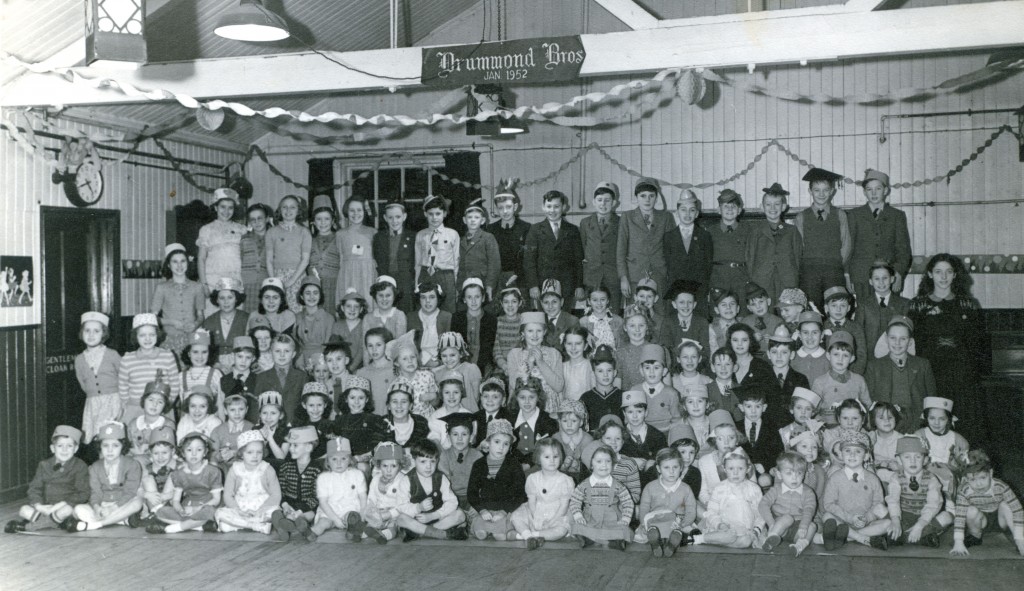 The sign on the beam suggests this party took place in January 1952.
