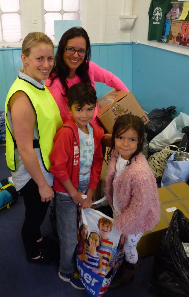 Christina with one of the families that brought in a donation of items to help the refugees in Calais.