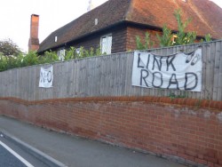 Signs proclaiming 'No Link Road' on a fence in Clay Lane, Jacobs Well.