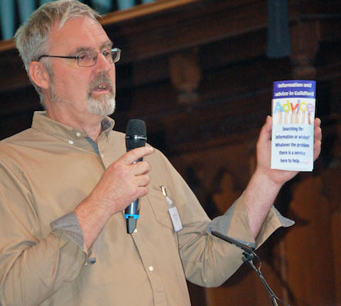 Haydn Morris of Catalyst holds a new free leaflet produced by Guildford Advice Services that lists details of lots of local advice services, organisations and agencies.
