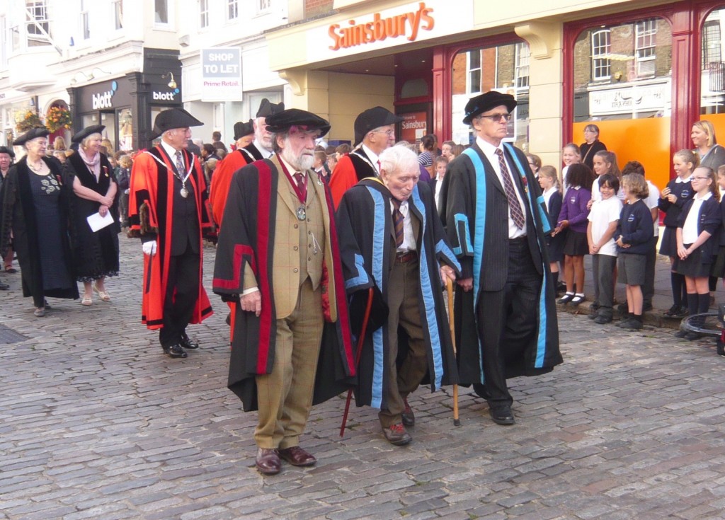 Guildford's most senior citizen Hon Freeman Bill Bellerby, flanked by Hon Freeman David Hodge and in the tweed suit the Hon Remrancer Mathheew Alexander. Behind them in the red robes are the Hon Aldermen.