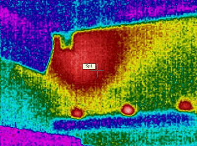 Thermal image of bees clustering in a hive in cold conditions. You vcan make out the straight edges of the hive, the cold exterior (blue) and the warm sperical cluster of bees within.