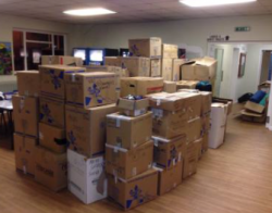 Boxes filled with donations ready to be taken to France for refugees.