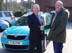 Cllr Graham Ellwood with taxi proprietor Richard Gough.