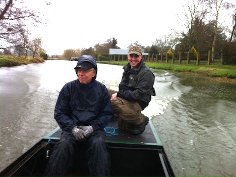 My volunteer Bob looks decidedly unimpressed with being asked to help move the newly refurbished punt in the driving rain.