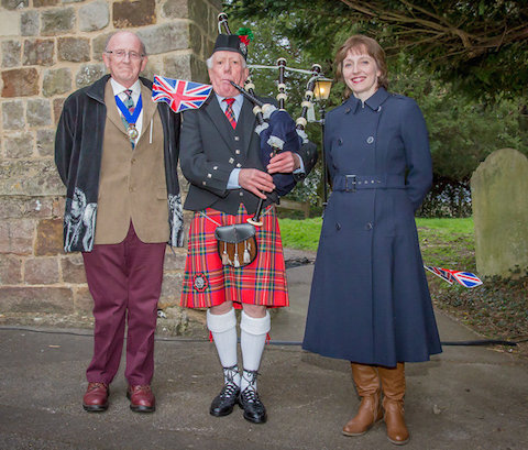 From left: the chairman of Worplesdon Parish Council, Dr Paul Cragg, piper Kenneth Thomson, and parish clerk Gaynor White.