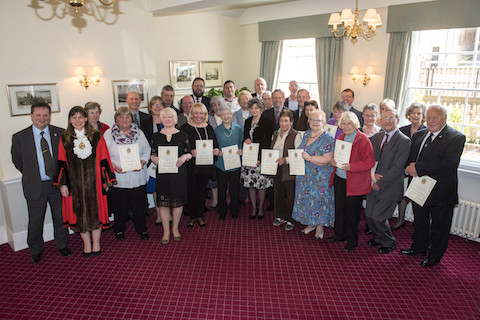 The recipients of the 2016 Mayor's Award for Commiunity Service, pictyred with the leader of Guildford Borough Council, Cllr Paul Spooner (far left) and thr mayor, Nikki Nelson-Smith. 