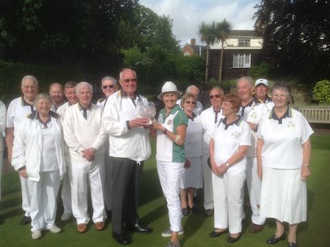 Castle Green captain Diana Summerhayes, presenting the Millennium Trophy to Astolat captain Alan Rice on June 12.