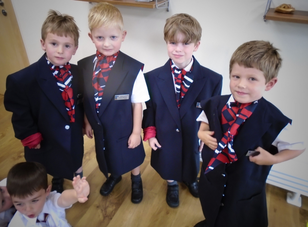 Cranmore lower preps dress up as BA air stewards, complete with name badges and neckerchiefs. "They said we will grow into them."