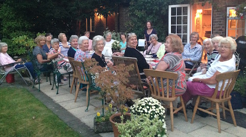 East Horsley Evening WI enjoying their summer evening party.