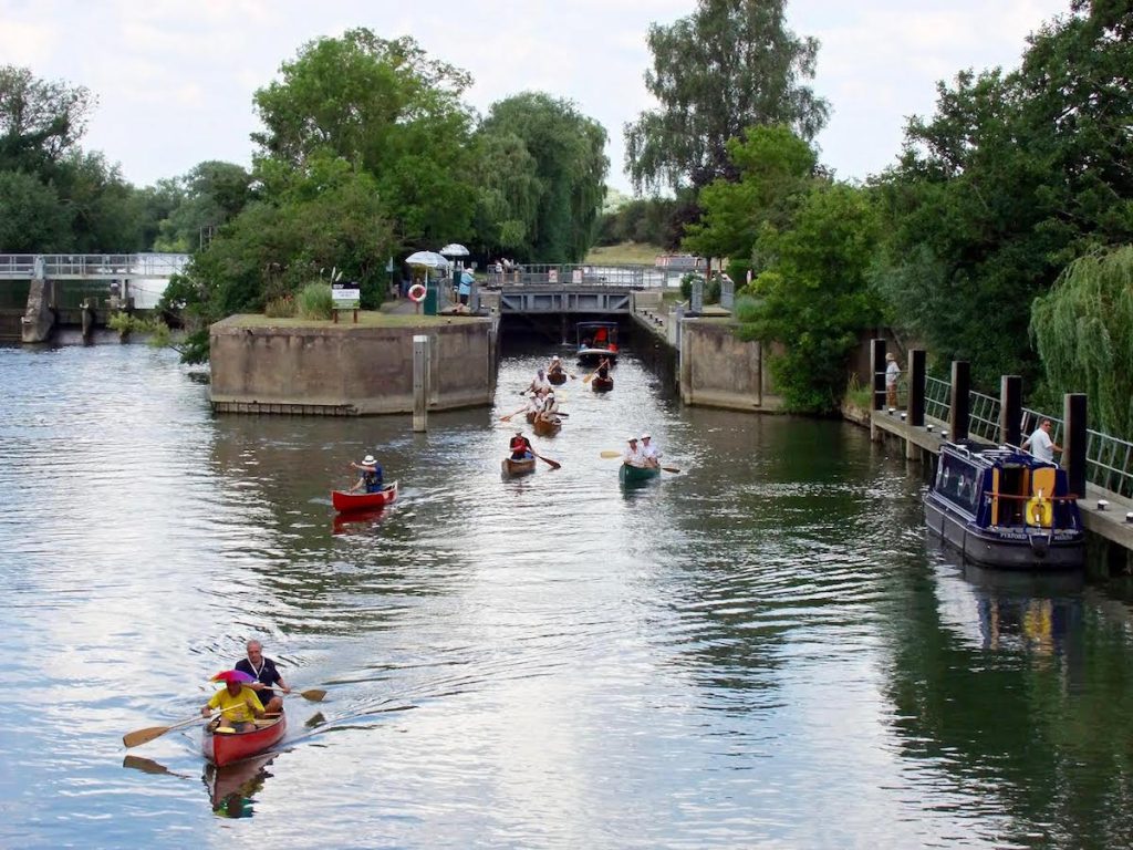 Traditional Thames Boats Society and Wooden Canoe Heritage Association (see links below) canoes leaving a Thames lock on 23 July 2016" Copyright Sue Milton