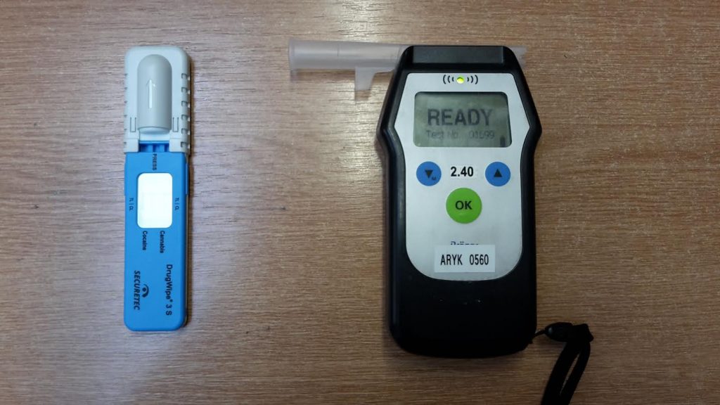 Police officers are equipped to detect alcohol and drugs in suspected drivers