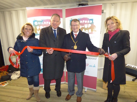 Cutting the ribbon to officially open the Guildford Pop Up Village. From left: Stephanie Maynardof the council's business team, Cllr David Bilbe, the mayor, Gordon Jackson, and Diana Parker of the council's business team.
