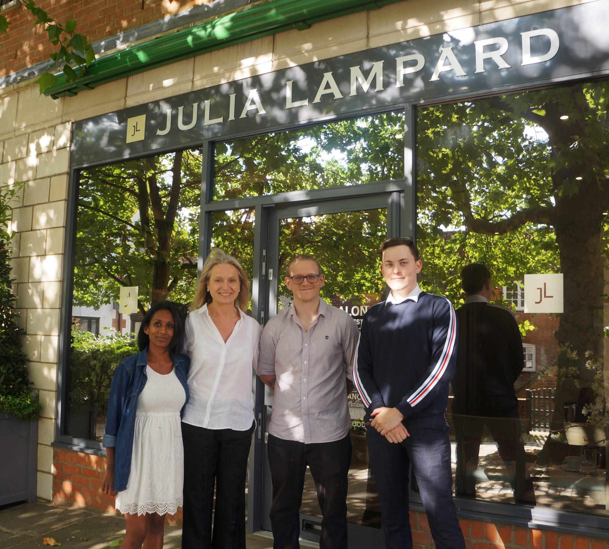 Julia Lampard, second from the left with hair stylists Megan Deutsch and Marcin Lisowski and receptionist, Josh Forster outside the Julia Lampard salon.