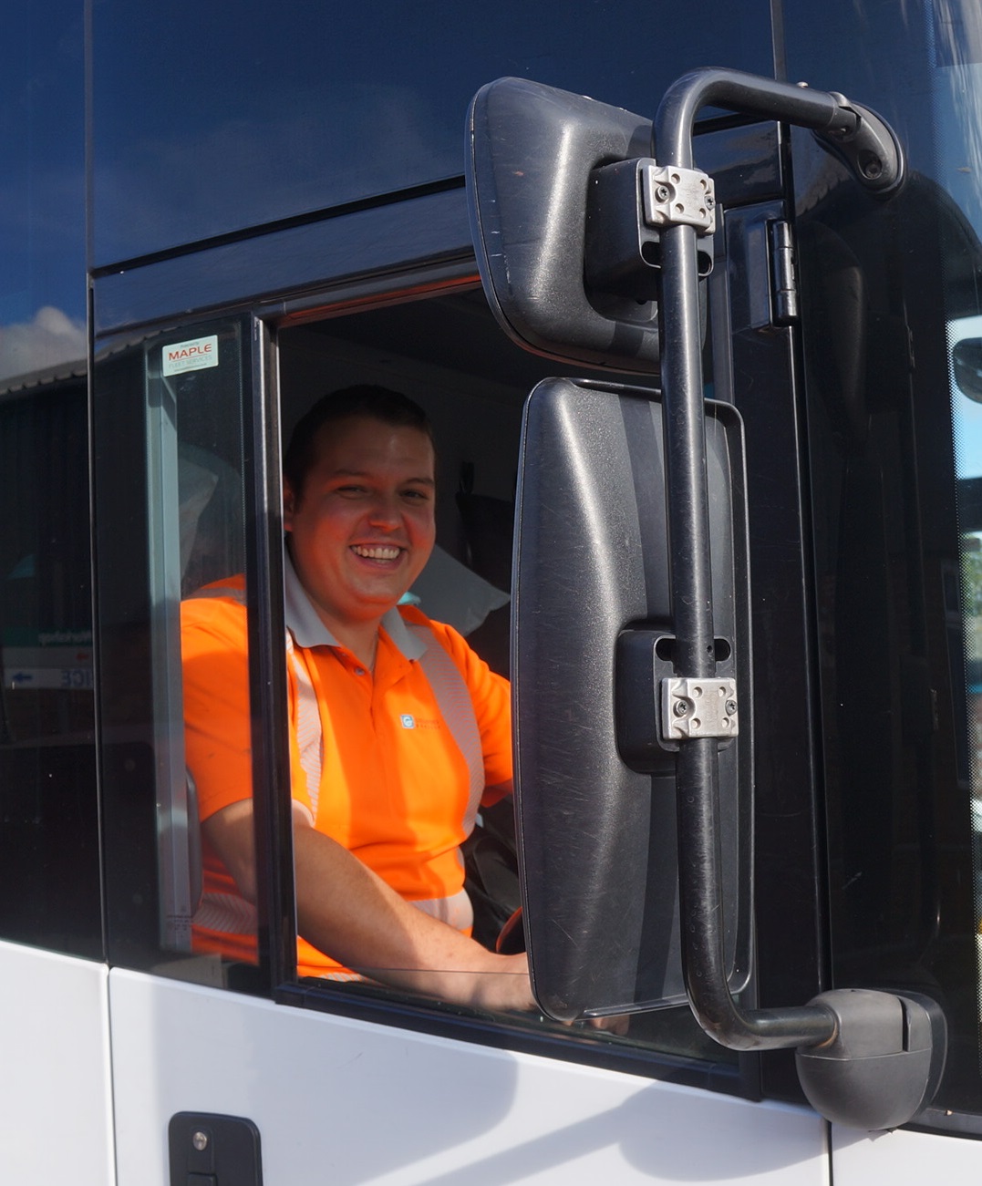 Csaba Dominyak in the spacious cab of his refuse truck. "I love driving the 26 tonne truck."